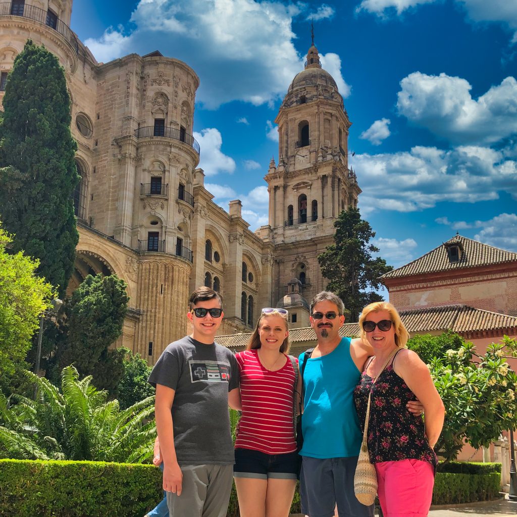 Travelers next to the cathedral of Malaga
